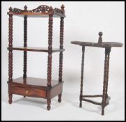 A 1920's clover leaf oak cake stand raised on barleytwist legs with finial centre and 3 leaf trays