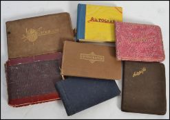 A good group of seven autograph albums containing annotations, sketches and autographs, dating