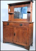 A Victorian Arts & Crafts solid oak mirror back si