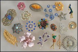 A large collection of costume jewellery brooches to include mostly mid to late 20th century. To