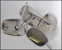 A large collection of vintage wing mirrors having