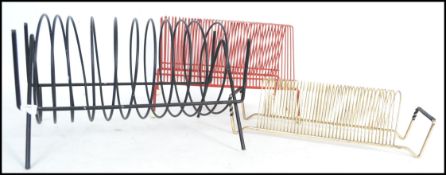 A group of three vintage retro 20th century atomic sputnik record racks for 45rpm record vinyl