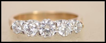 A hallmarked 9ct gold 5 stone ring set with five g