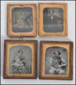 A group of four 19th century Victorian Daguerreotype portrait pictures set in ornate gilt frames.