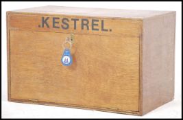 A scratch built portable ply wood stationary desk top box having a lockable full front door