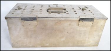 An unusual stainless steel box, with Oriental characters to cover, hinged lid, with lid and the base