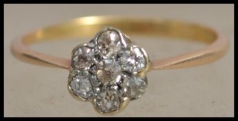 An 18ct gold and diamond cluster ring with 7 old c