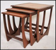 A retro 1960/70s G-Plan teak wood and tile top nest of tables. Raised on squared legs with