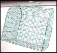 A 20th century retro blue plastic wirework covered