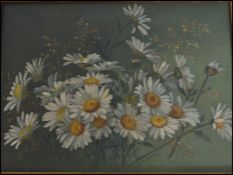 A 20th century oil on canvas still life painting of daisies set in an ornate gilt frame.
