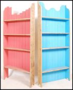 A pair of upcycled painted pine open window bookcase cabinets, each of two tone colours, blue and
