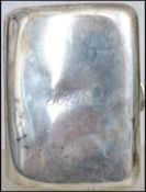 An Edwardian silver hallmarked cigarette case having central monogram for HP to centre. Hallmarked