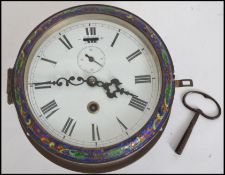 An early 20th century bulk head clock having faceted hands and Roman numeral chapter ring with