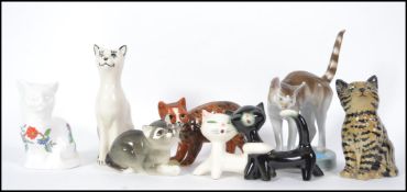 A collection of cat ceramics to include Goebels 1920's car on base, USSR, Goebels entwined cats,