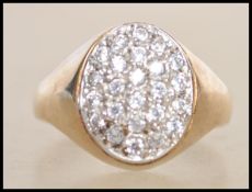 A hallmarked 9ct gold cluster ring set with white