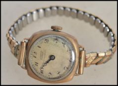 A vintage early 20th century ladies 9ct gold / 375 marked dress watch by Tissot on expanding