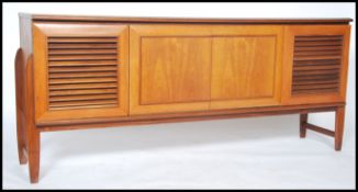 An unusual vintage retro 20th century teak wood Danish inspired sideboard consisting of two outer