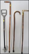 A collection of walking sticks to include a silver collar example with London hallmarks together