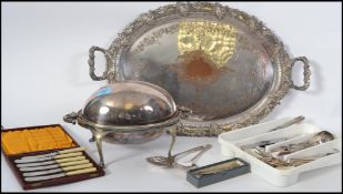 A good collection of silver plated wares to include cased sets of flatware, bacon warmer with spoon,