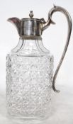 Greyhound Racing Interest. A silver plated and cut glass claret jug decanter with notation to the