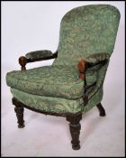 A good Victorian Aesthetic movement library armchair in pitch pine raised on shaped legs with