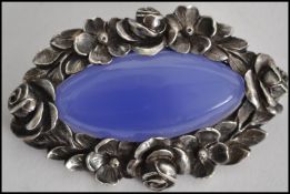 A  silver 935 continental vintage ladies silver brooch with inset glass blue lozenge stone with