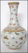 A believed 19th century Oriental ceramic Guangxu famille butterfly pattern vase having a bulbous