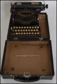 An unusual 20th century industrial vintage Corona reporters folding small typewriter retailed by