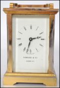 A 20th century brass cased carriage clock by Garra