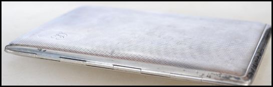 A hallmarked silver cigarette case bearing hallmarks for Birmingham 1941 makers Smith & Bartlam