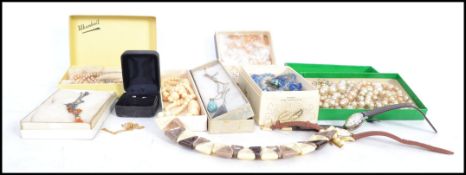 A collection of vintage costume jewellery to include silver, white metal and yellow metal necklace