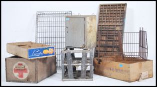 A collection of retro items / industrial to include metal milk bottle crate, first aid wooden box,