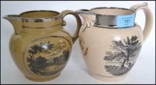 Two early 19th century Mocha Ware style jugs having Manor House scenes to front. Both unmarked but