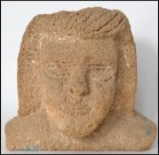 An unusual 20th century stone carved bust of a South American native with good details and raised on