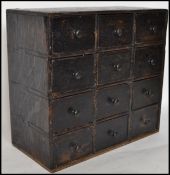 An early 20th century ebonised oak specimin having
