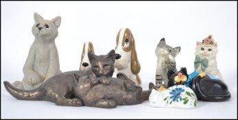 A collection of cats to include Szeiler, Quarry Critter, Cordelia Pottery,Polly Doodle's Dough by