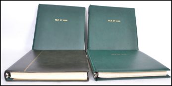 A collection of Isle of Man and Alderney stamp albums in the presentation sleeves