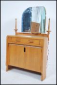 A 1950's oak half moon shaped Ernest Gomme / G-Plan oak  dressing table chest having shaped