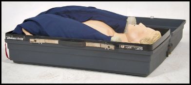 A vintage cased Resusci Anne resuscitation doll complete in the original case. Measures 50cm high
