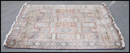 A good Persian, Central Iranian Kashan silk and cotton rug with central ground medallions and