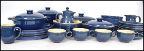 A 20th century Denby part dinner service having a cobalt blue glaze consisting of various plates,