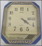 A retro 1970's shop advertising wall clock for Sei