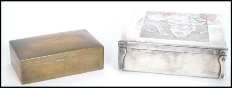 A fantastic early 20th century silver on copper table top cigarette box. The hinged chase