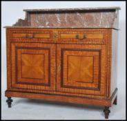 A late 19th century satin wood and rouge marble washstand - side cabinet being raised on turned legs