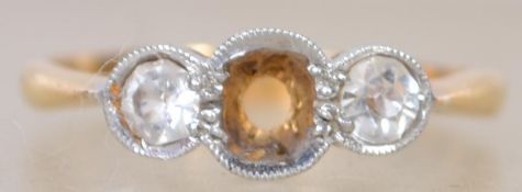 A 22ct gold and platinum amethyst set 3 stone ring. The amethyst set to centre being loose,