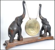 A 1920's Burmese elephant gong. The table top gong with hand beaten brass gong suspended from chains