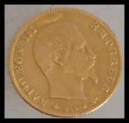 A 19th century Napoleon III gold 5 Francs coin, dated 1860. Total weight 1.6g