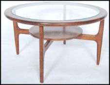 A vintage retro 20th century G Plan? atomic teak wood circular coffee table, drop in glass top