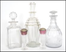 A stunning early 20th century Art Deco glass decanter with stopper along with two other cut glass