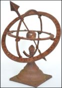 A vintage 20th century cast iron armillary sundial with central arrow and a Roman numeral chapter